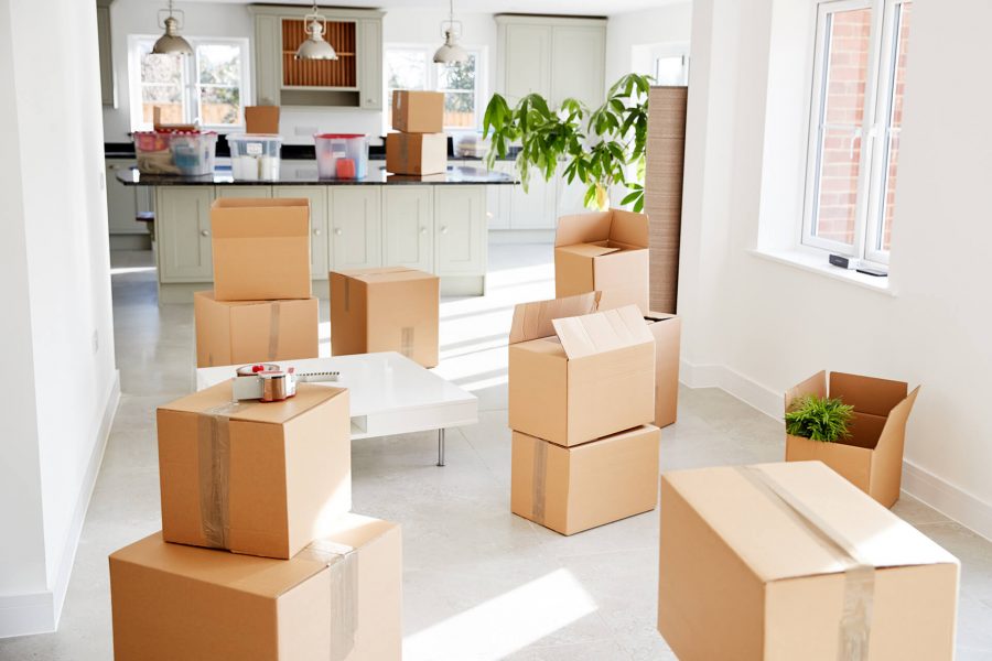 stacked-removal-boxes-in-empty-room-on-moving-day-RMYEDG3.jpg
